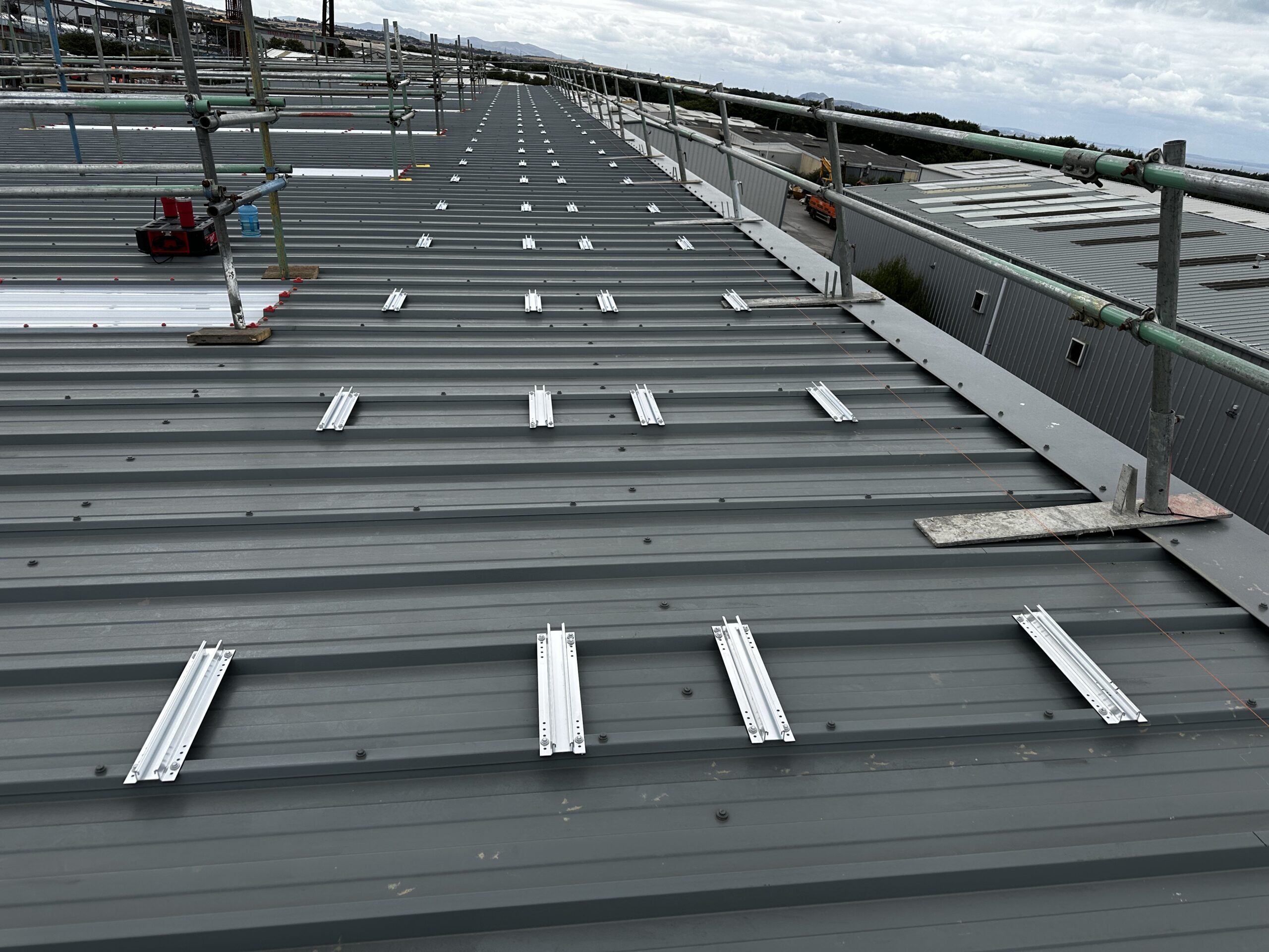 Commercial roof prepared with mounting rails for solar panel installation