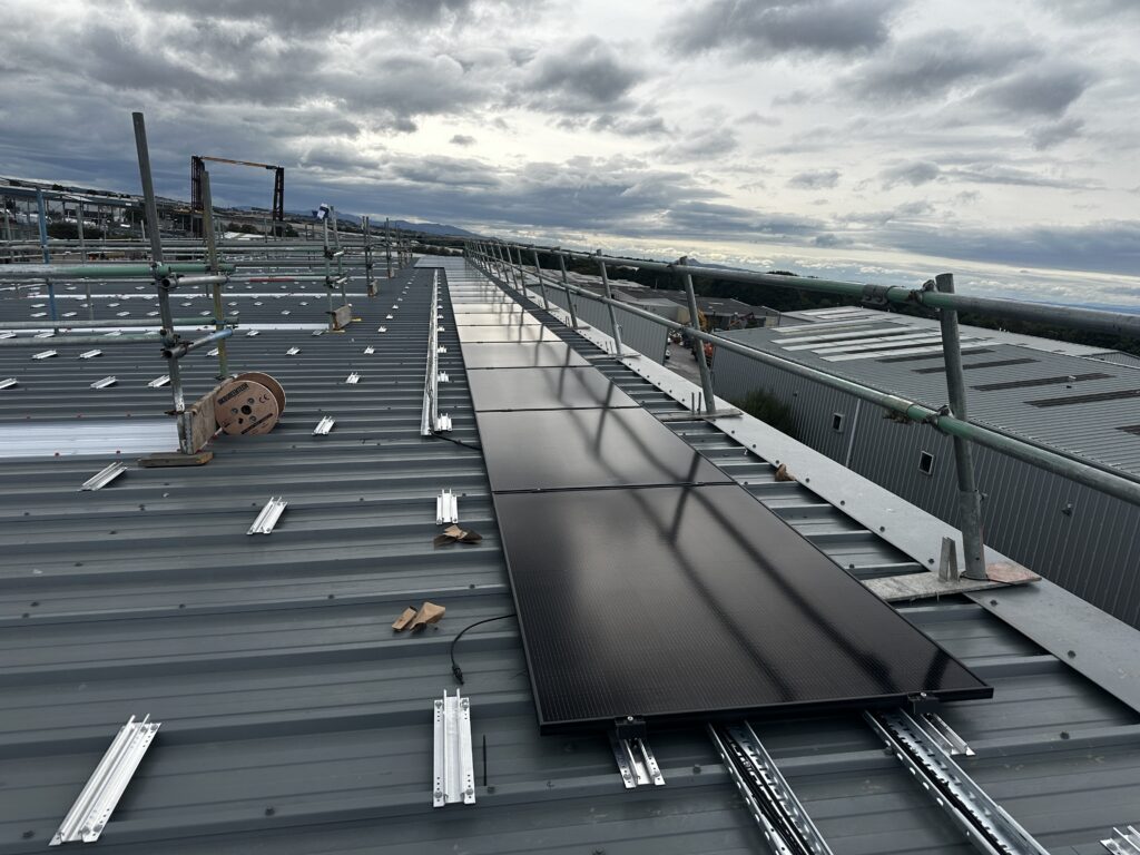 Commercial solar panels and mounting system on an industrial roof